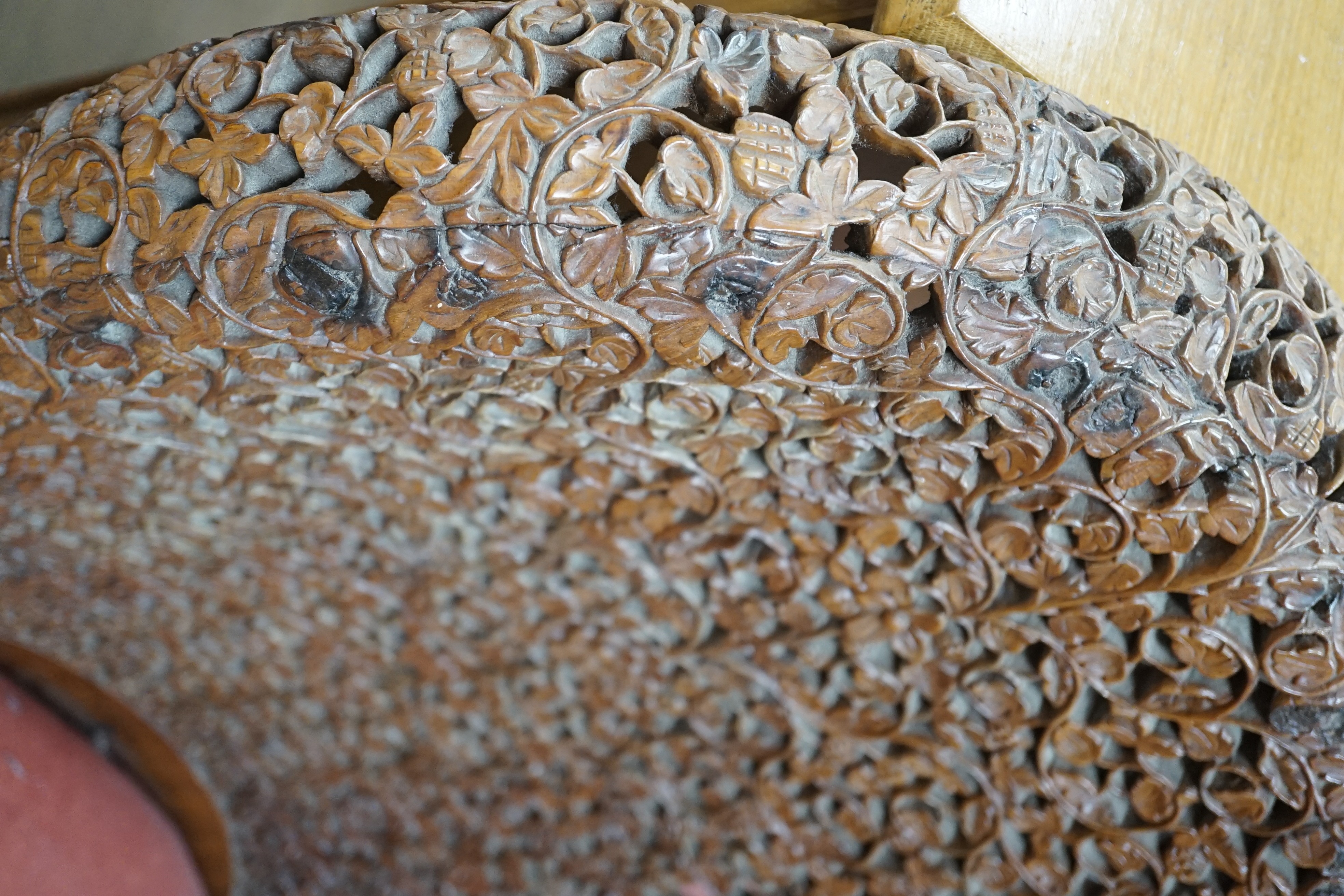 A Burmese carved hardwood circular occasional or centre table, diameter 57cm height 74cm, together with a similar side chair and foot stool